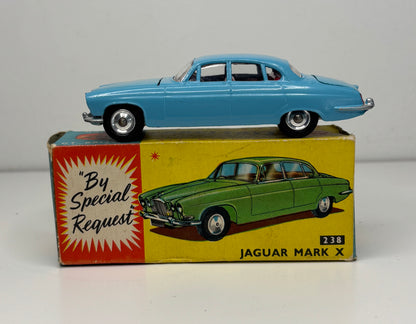 Model car on top of its box with a Jaguar Mark X illustration and text 'By Special Request' on a gray background.