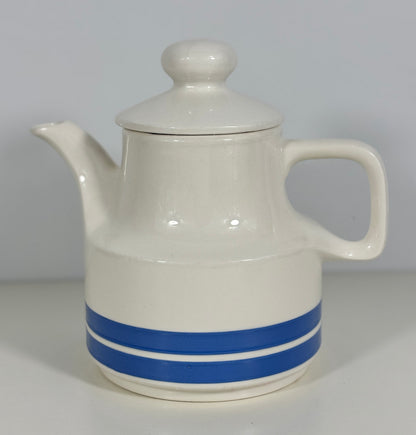 White ceramic teapot with a blue stripe on a white background