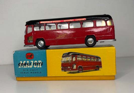 Model bus on top of its packaging box with 'Corgi Toys' branding.