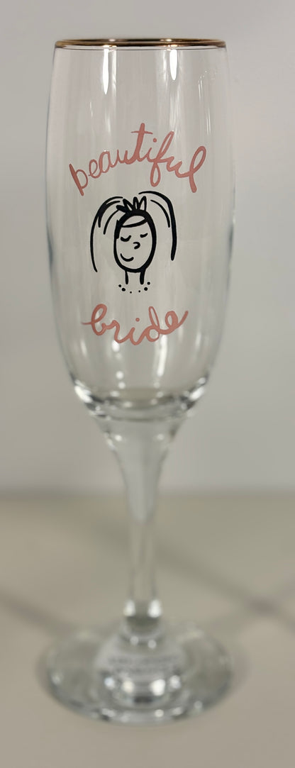 Champagne flute with 'beautiful bride' text and a small illustration on a white background