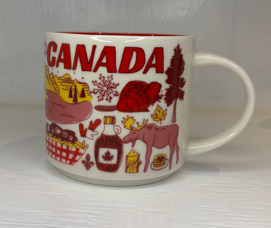 Mug with Canadian-themed illustrations on a white background