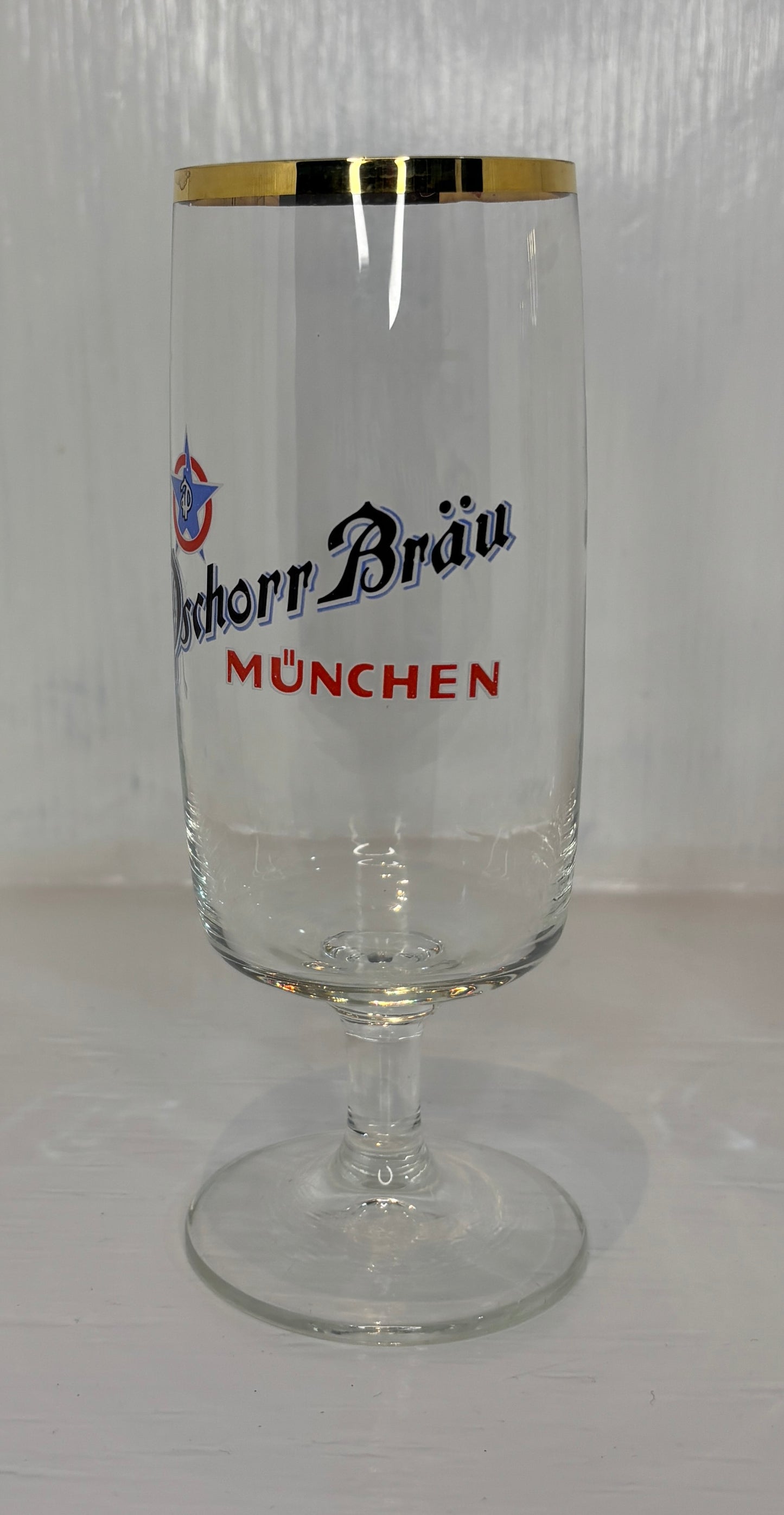 Clear glass with gold rim and 'Bockhor Bräu München' branding on a white background