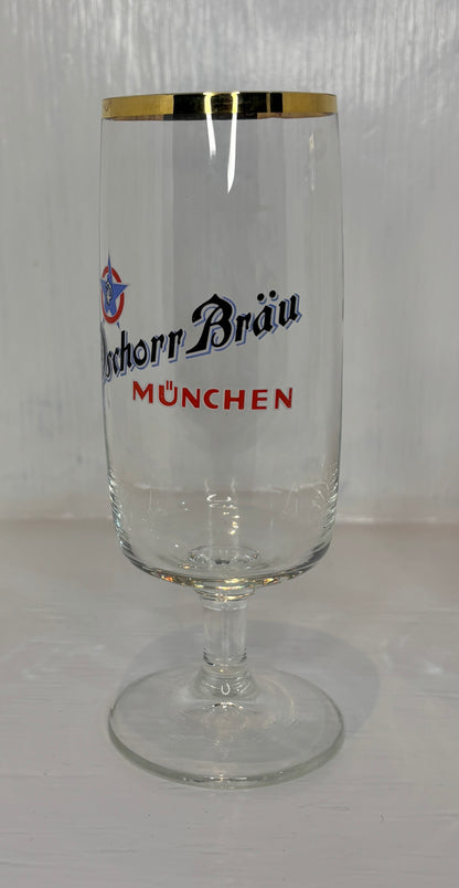 Clear glass with gold rim and 'Bockhor Bräu München' branding on a white background