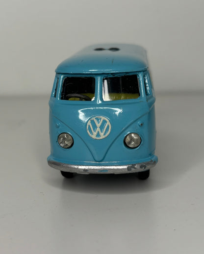 Model of a blue Volkswagen van on a gray background