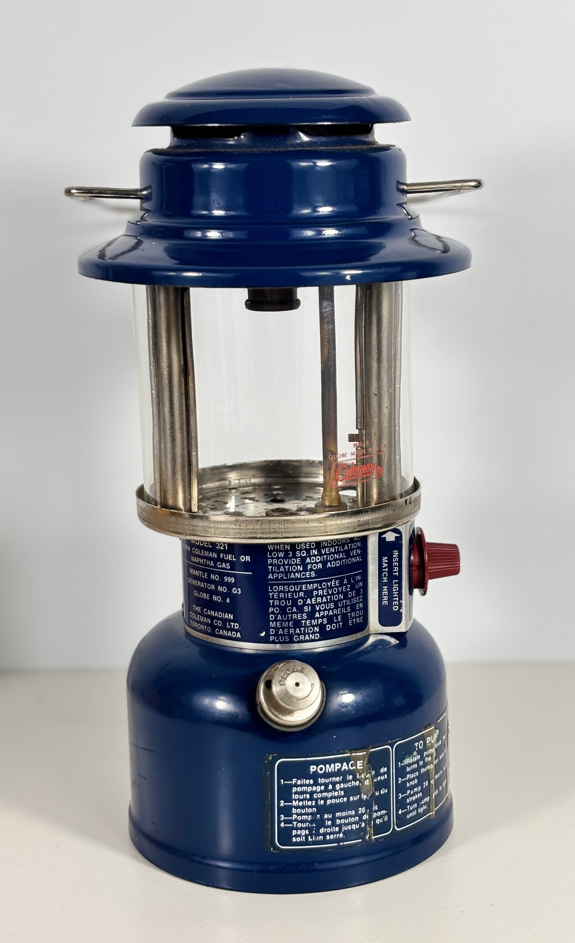 Blue camping lantern with visible branding on a white background