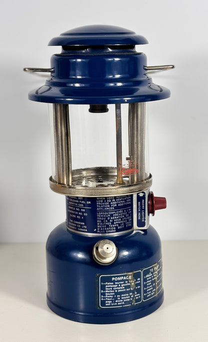 Blue camping lantern with visible branding on a white background