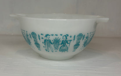 White mixing bowl with blue pattern on a white background