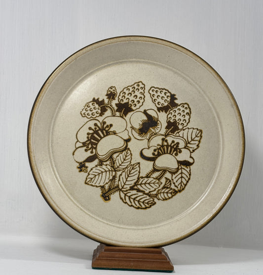 Ceramic plate with floral design on a white background