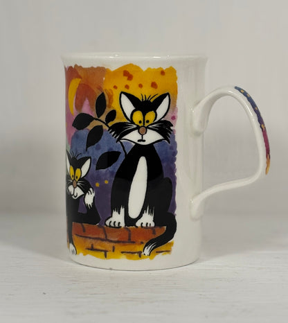 Mug with a black and white cat design on a plain background