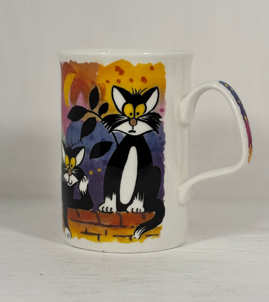 Mug with a black and white cat design on a plain background