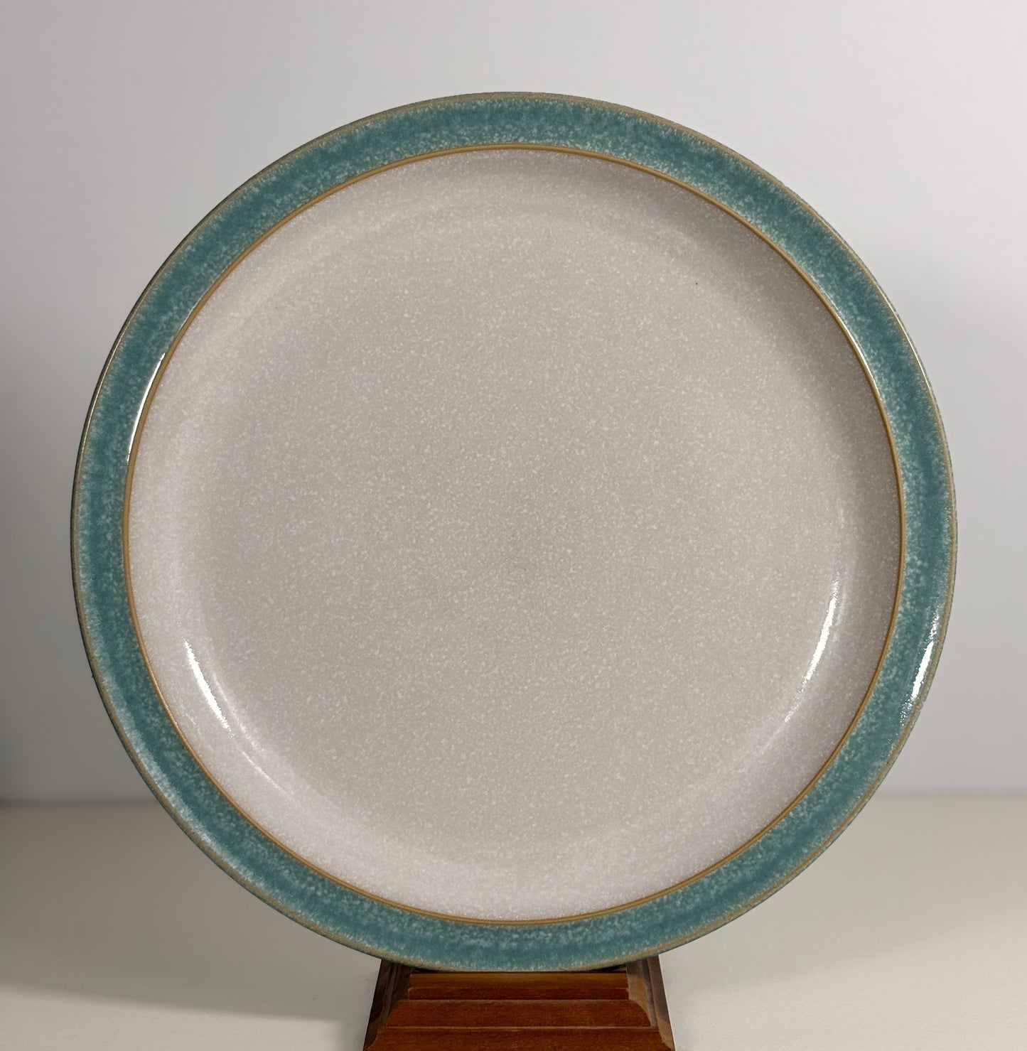 Ceramic plate with a blue rim on a white background