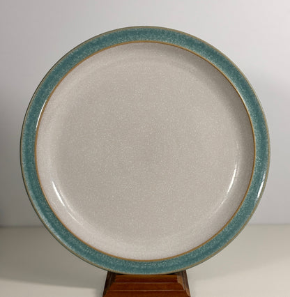 Ceramic plate with a blue rim on a white background