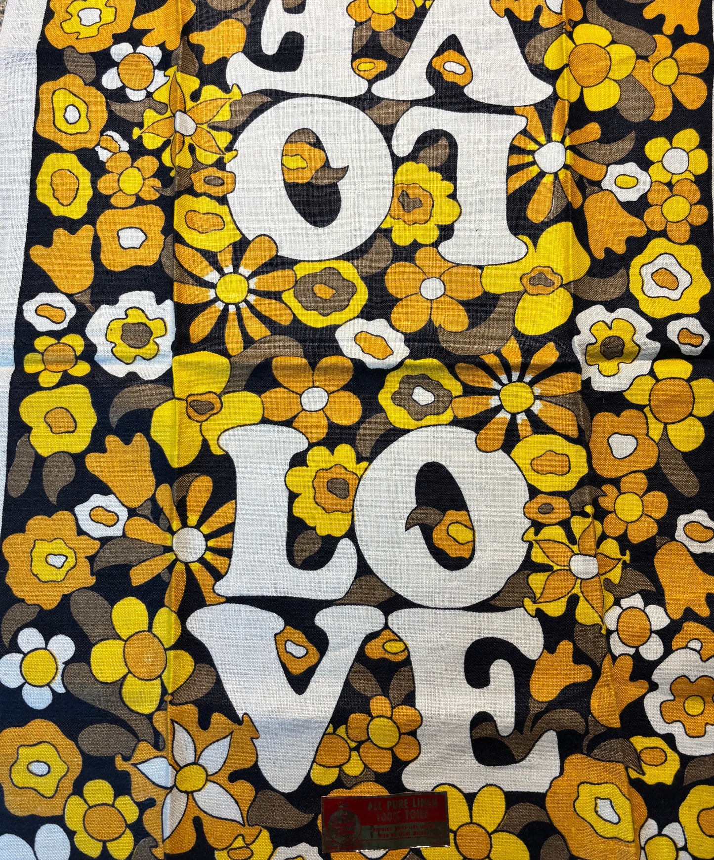 Floral patterned fabric with 'LOT LOVE' text in white on a black background