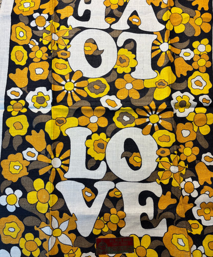 Floral patterned fabric with 'LOT LOVE' text in white on a black background