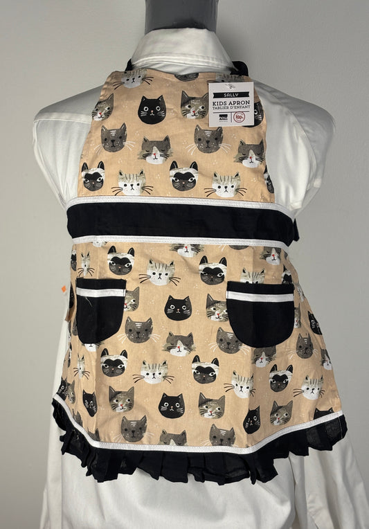 Apron with cat pattern on a mannequin against a gray background