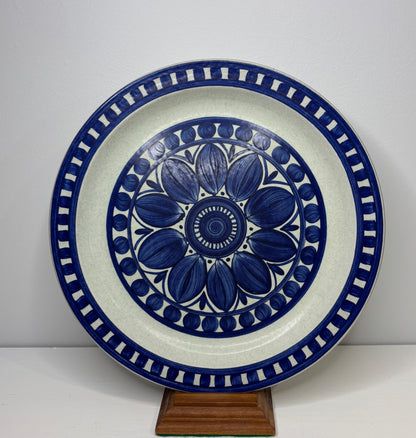 Decorative ceramic plate with blue floral design on a white background