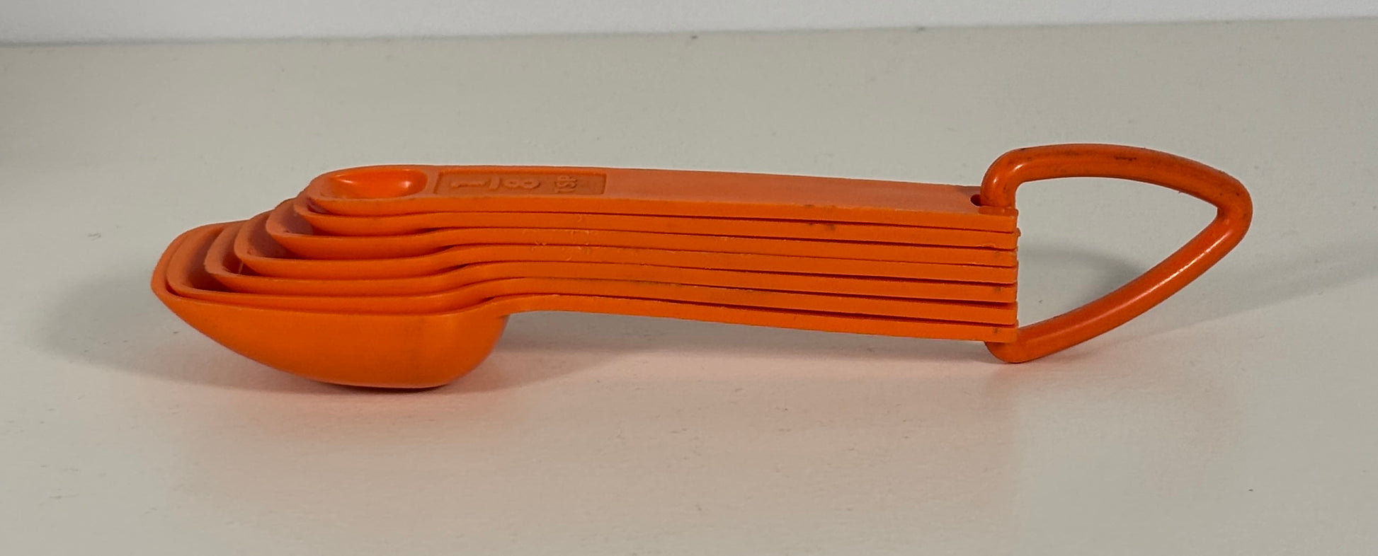 Orange Tupperware Measuring Spoons