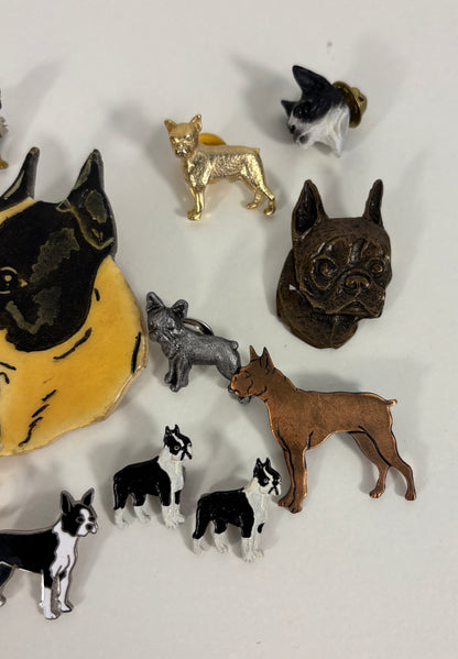 Collection of dog pins  in various poses and colors on a white background