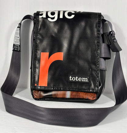 Black shoulder bag with orange 'r' logo and 'totem' branding on a light gray background