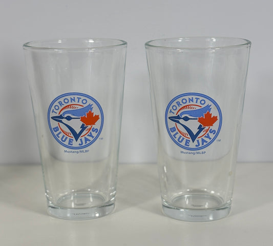 Two clear glasses with Toronto Blue Jays logo on a white background