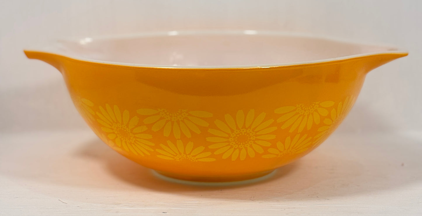 Yellow floral-patterned bowl on a white background