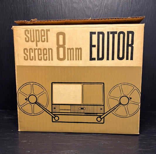 Cardboard box with 'super screen 8mm EDITOR' text and reel-to-reel tape illustration on a black background