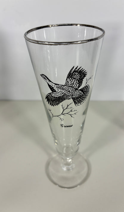 Clear glass with black bird design on a white background