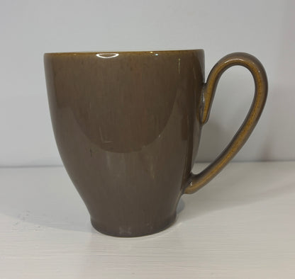 Brown ceramic mug on a white background