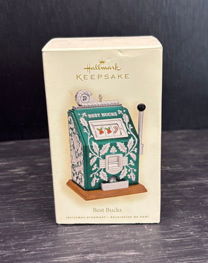 Hallmark Keepsake Christmas ornament packaging with slot machine design on a dark surface.
