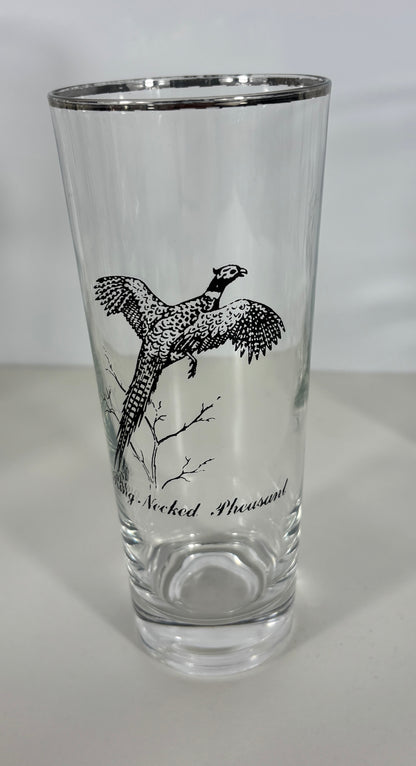 Clear glass with a black bird illustration and text on a white background