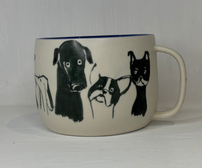 White mug with black illustrations of dogs on a white background