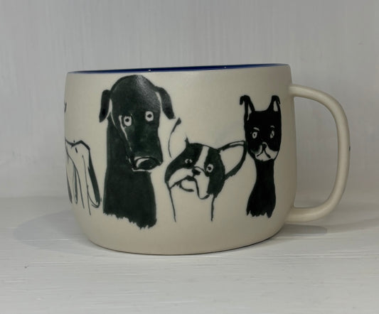 White mug with black illustrations of dogs on a white background