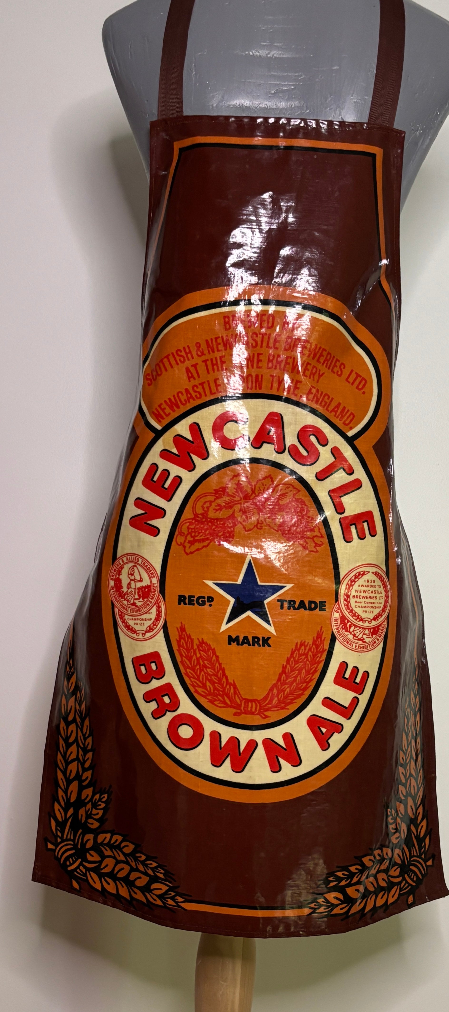 Newcastle Brown Ale apron on a mannequin against a white background
