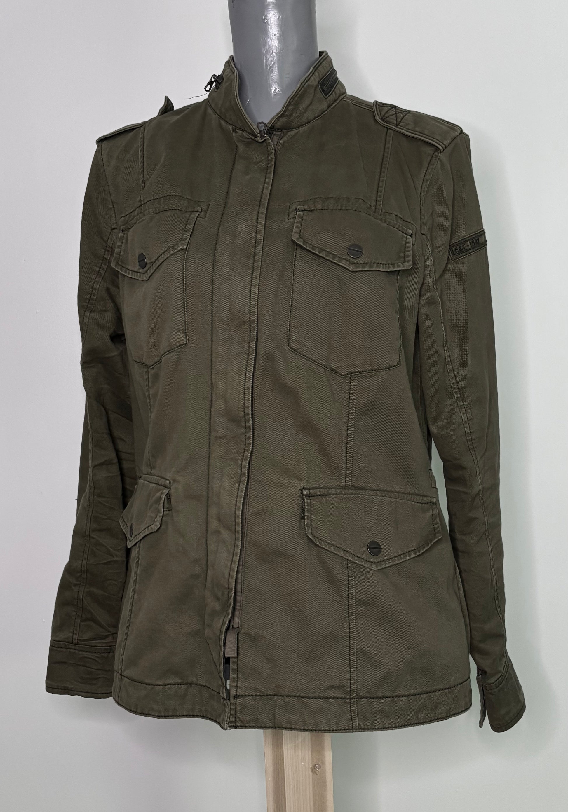 Green jacket on a mannequin against a white background