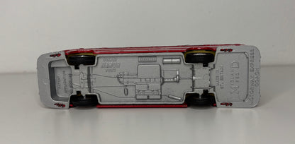 Model car chassis with visible branding on a white background