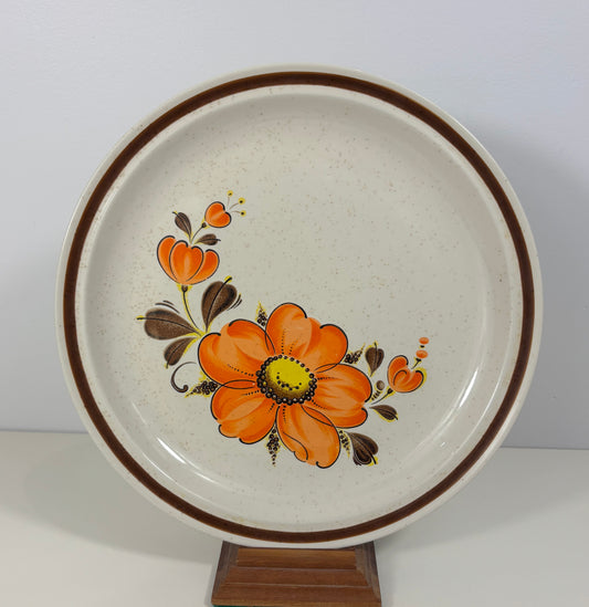Ceramic plate with floral design on a white background