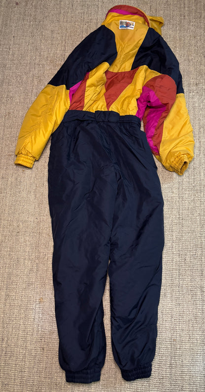 Colorful snowsuit with a jacket and pants on a textured surface