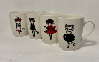 Set of four mugs with illustrated cat characters on a white background