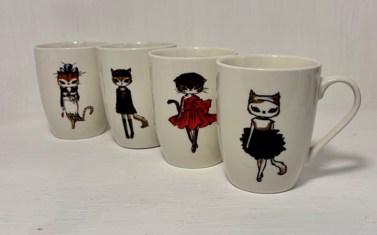 Set of four mugs with illustrated cat characters on a white background