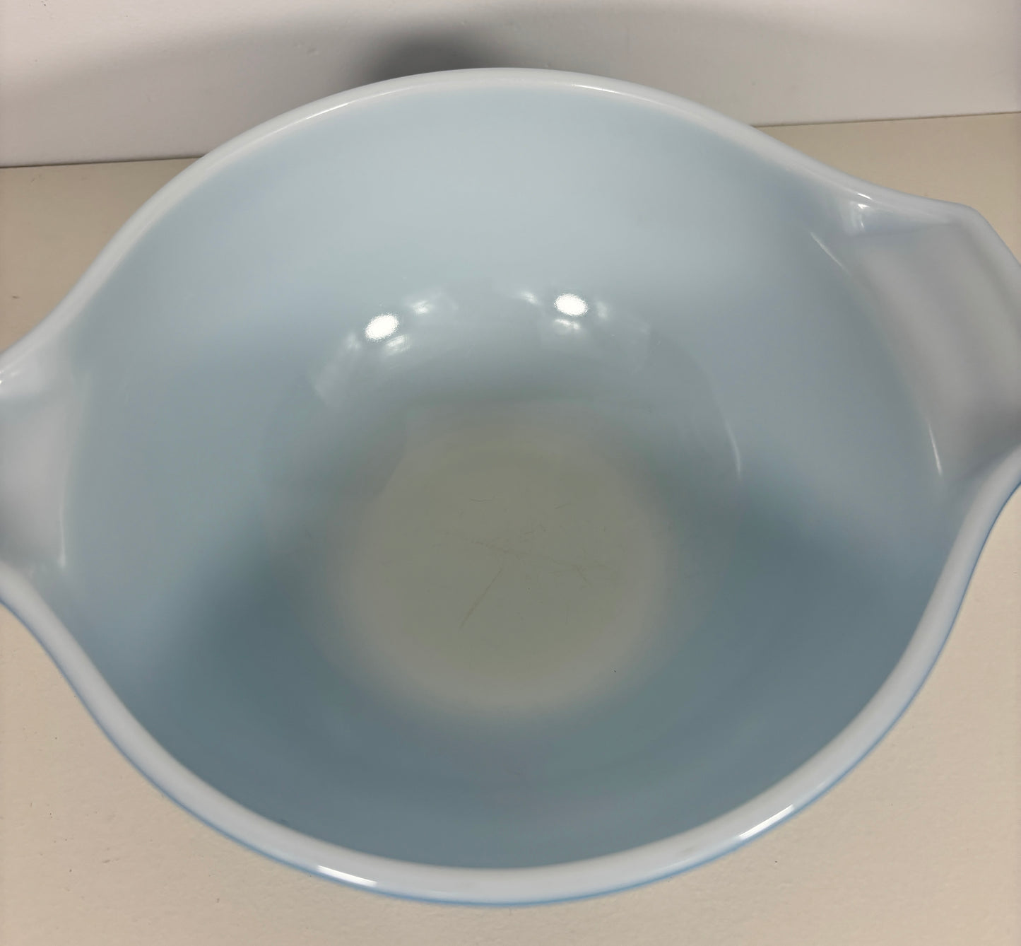 Light blue ceramic bowl on a white background