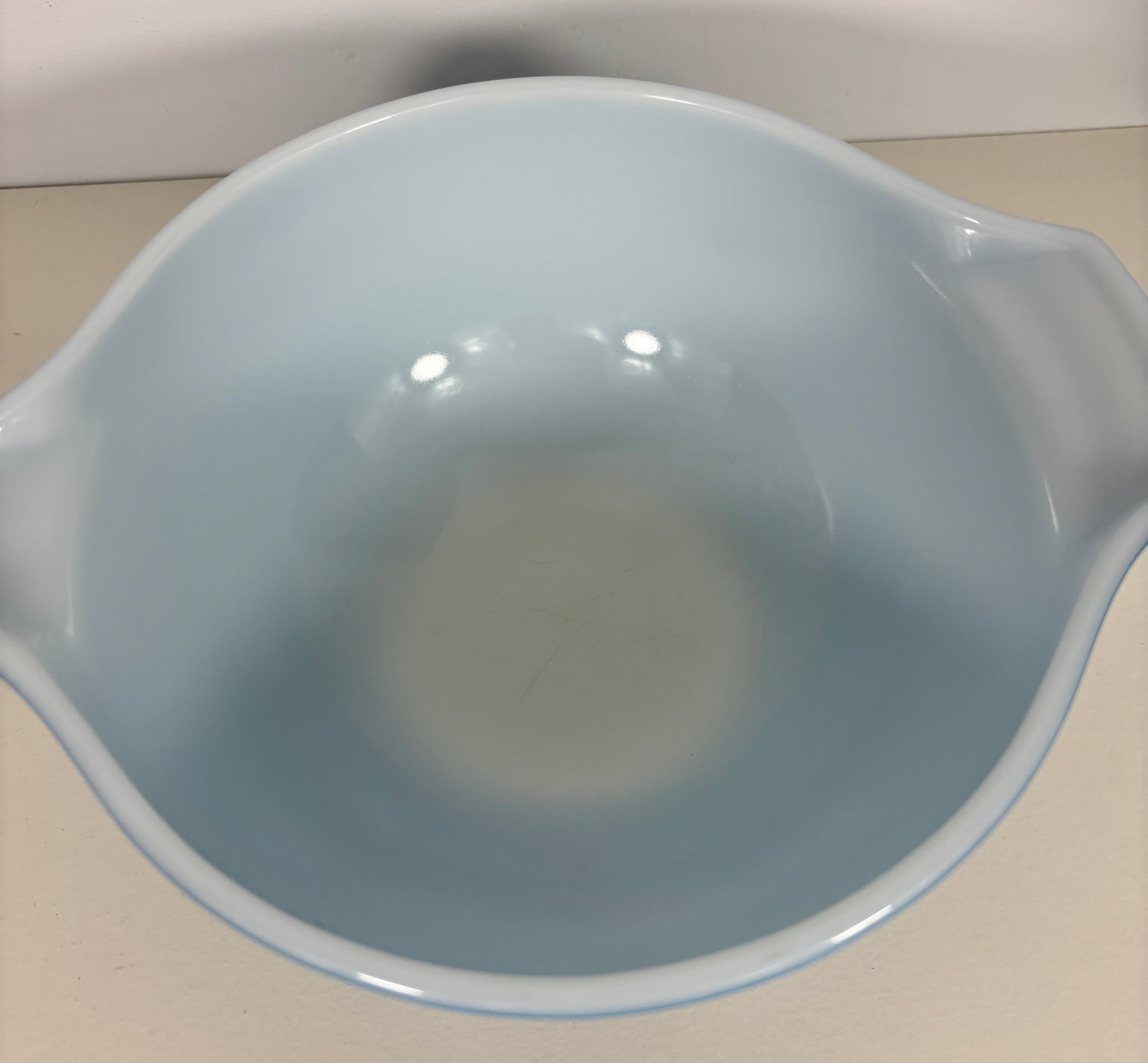 Light blue ceramic bowl on a white background