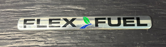 Flex Fuel emblem on a wooden surface