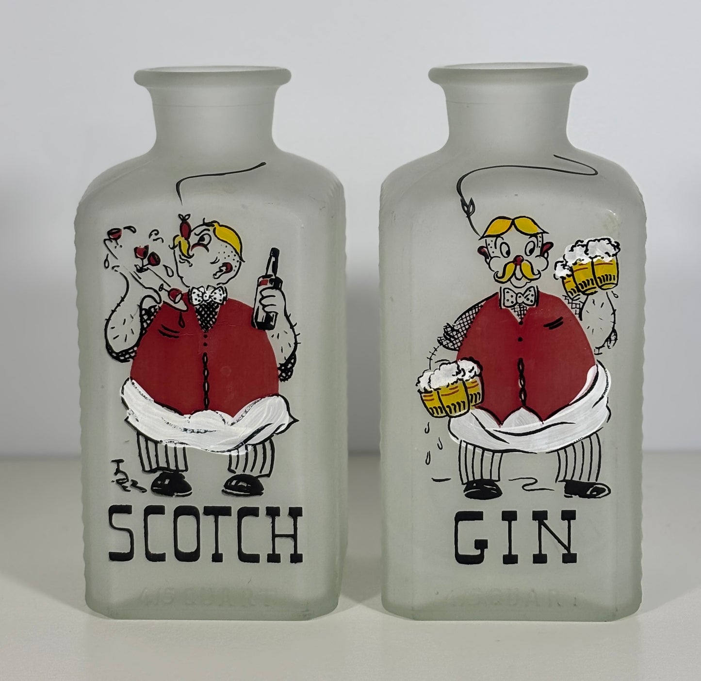 Two frosted glass bottles labeled 'Scotch' and 'Gin' with cartoon characters on a white background.