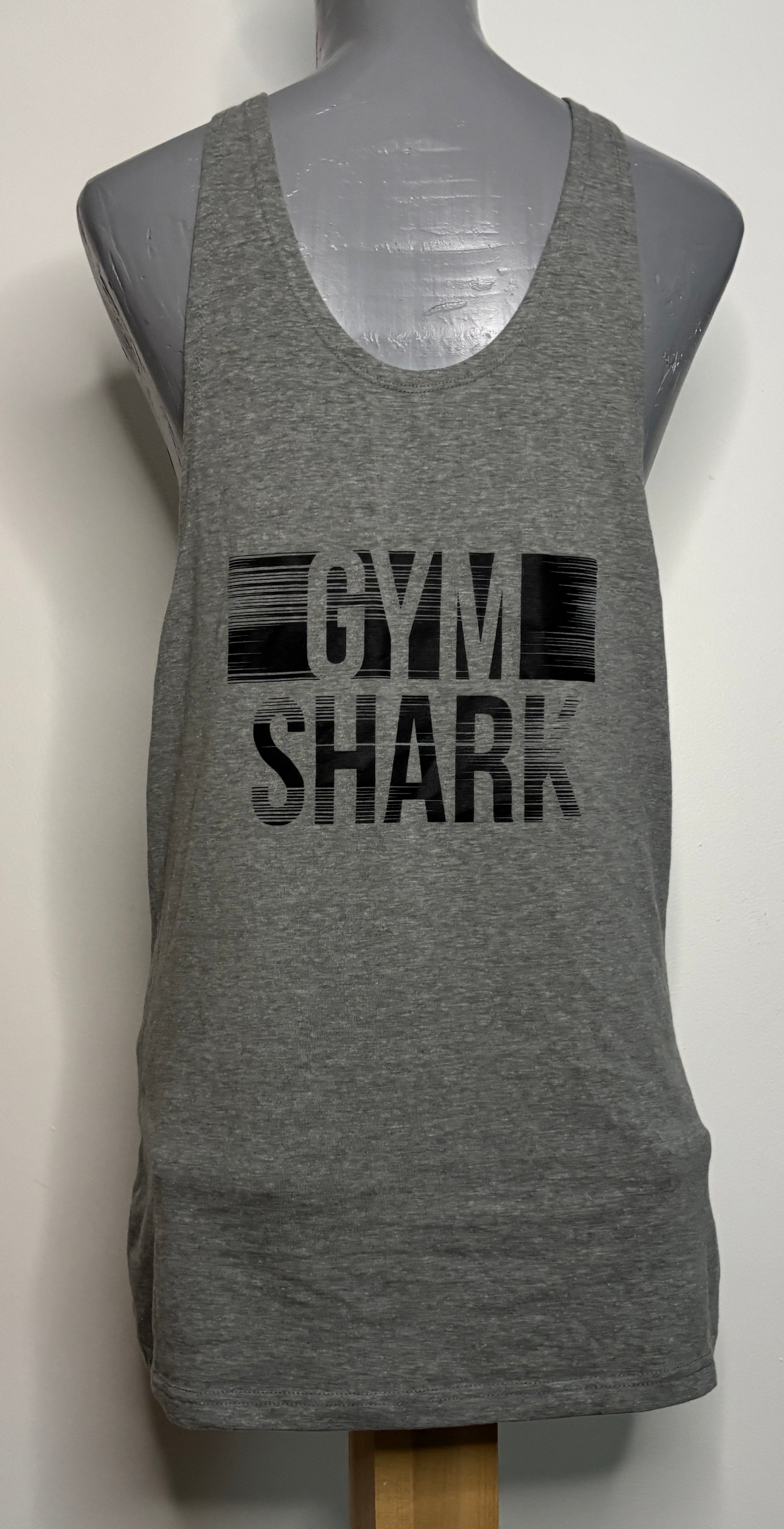 Gray tank top with 'GYM SHARK' text on a mannequin against a white background