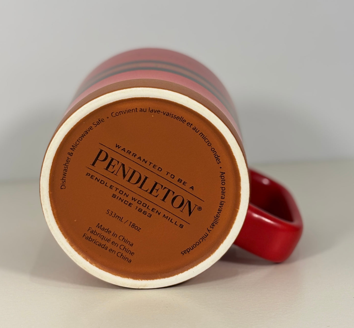 Red mug with Pendleton branding on a white background