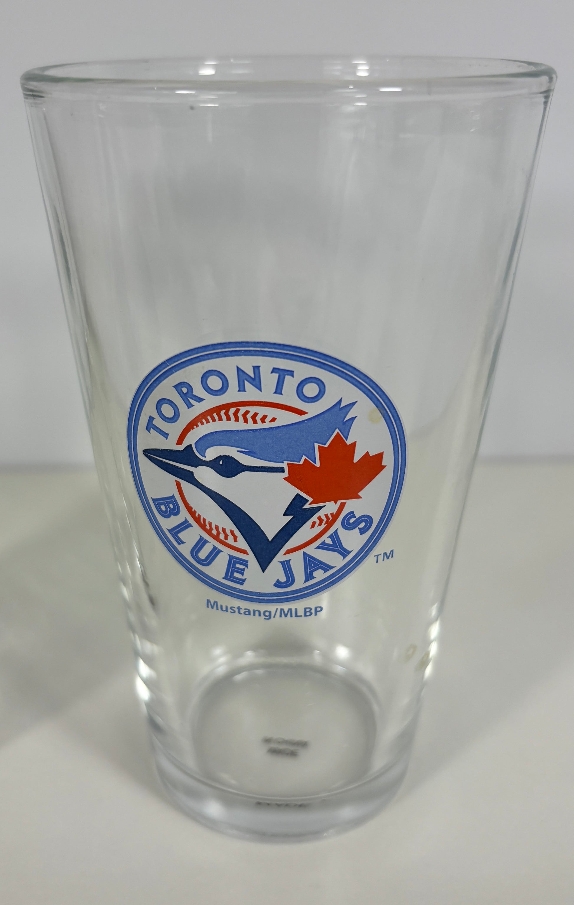 Clear glass with Toronto Blue Jays logo on a white background
