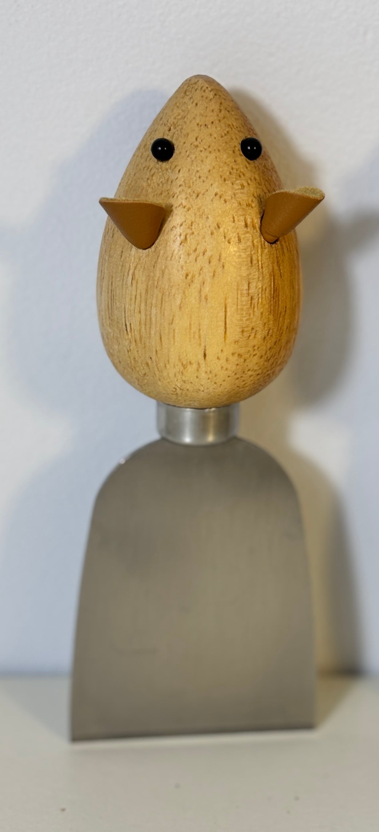 Wooden  mouse shaped cheese knife on a white background