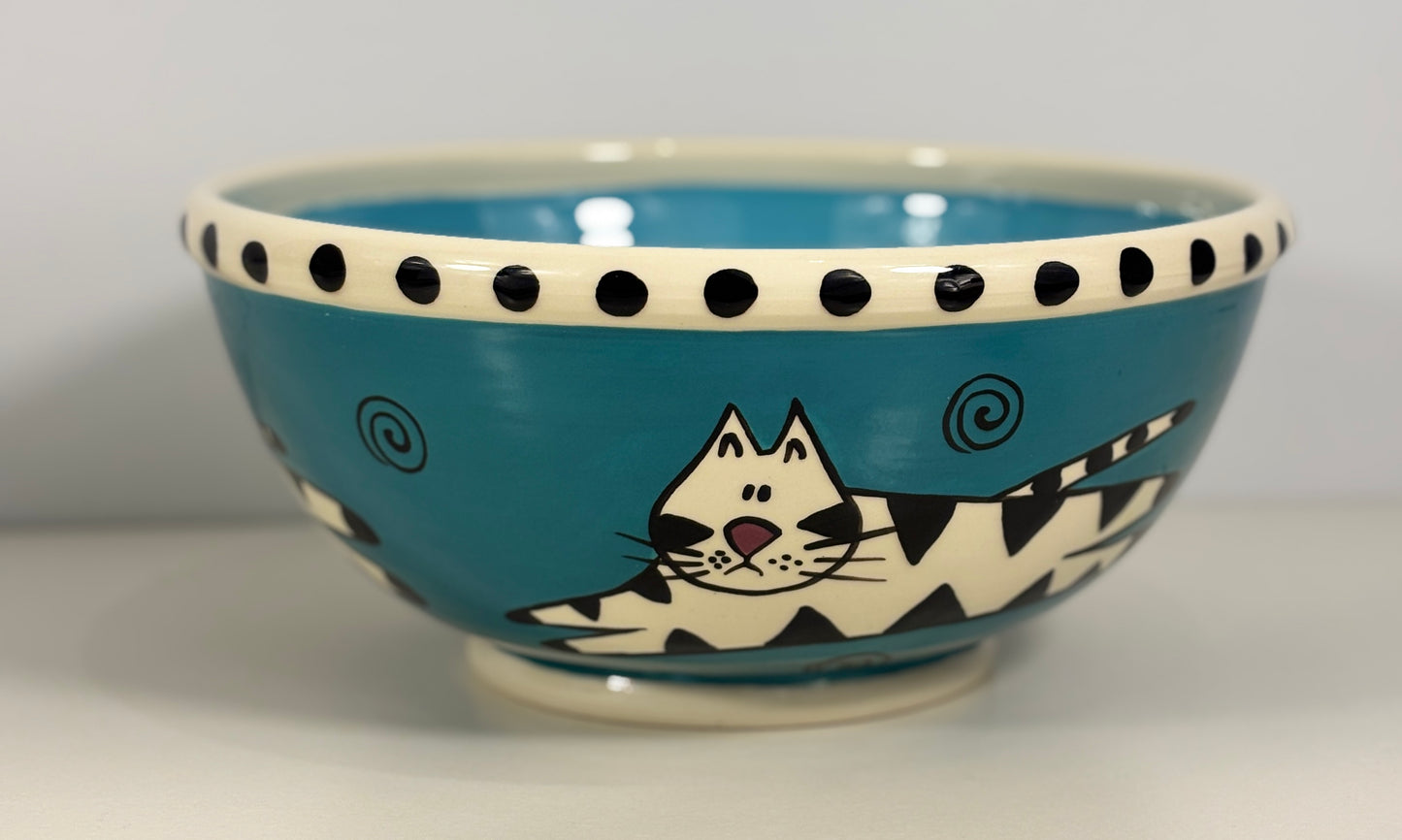 Ceramic bowl with a cat design on a blue background