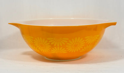 Yellow bowl with floral pattern on a white background
