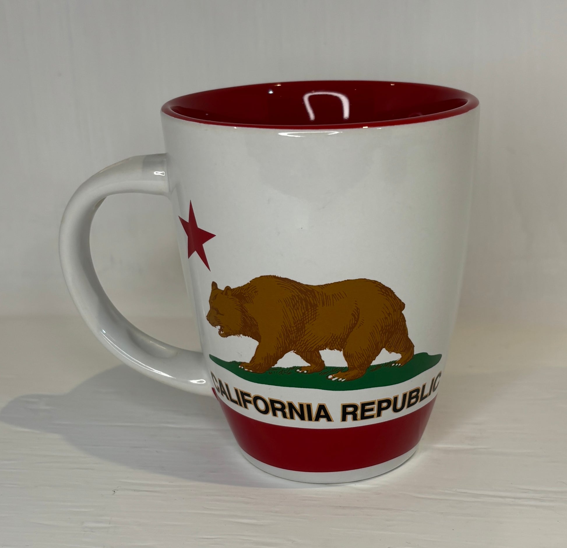 White mug with California Republic design featuring a bear and red star on a white background